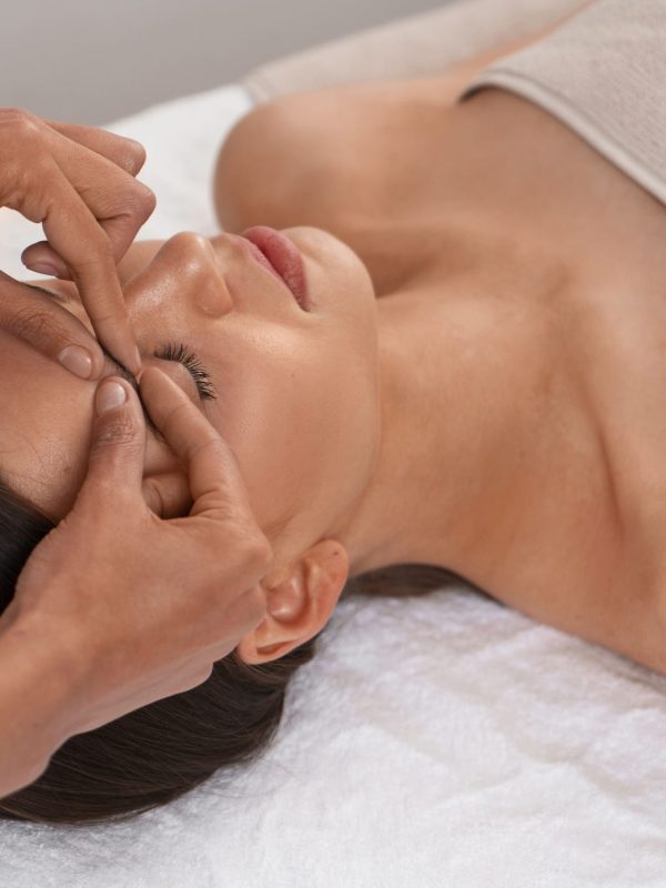 view-woman-getting-facial-yoga-massage-stay-young (1)