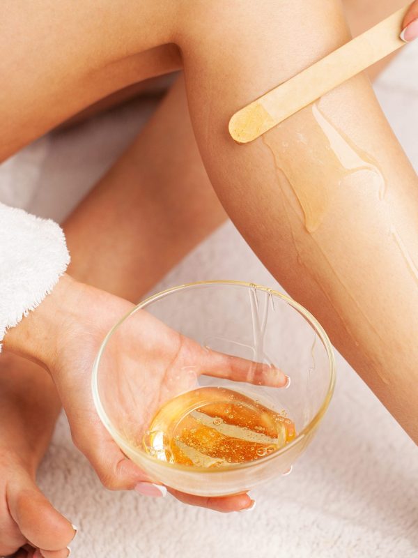 woman-with-perfect-skin-her-legs-applied-wax-remove-hair (1)